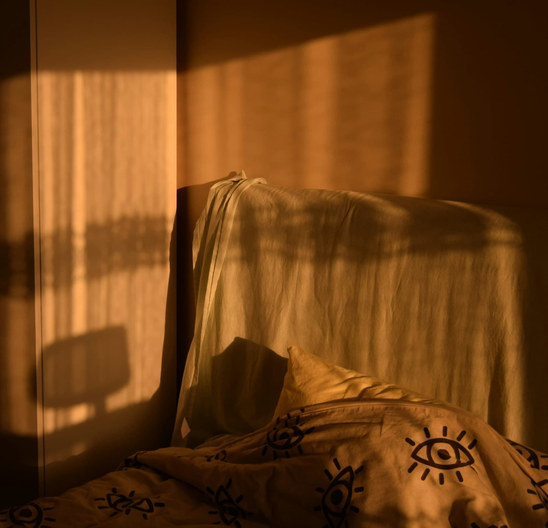A room under the eaves in deep amber light