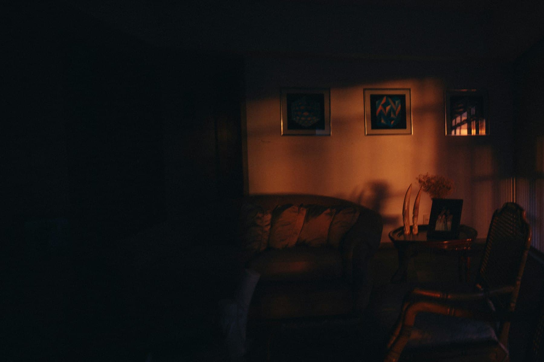 A living room in low amber light